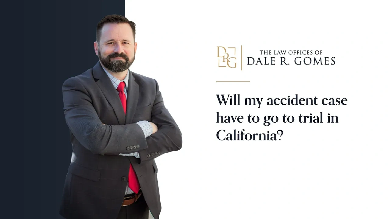 A man in a suit stands with arms crossed next to text that reads, "Will my accident case have to go to trial in California?" and the logo for The Law Offices of Dale R. Gomes.