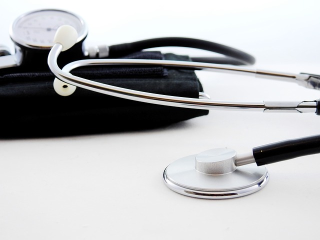 A stethoscope and blood pressure cuff are placed on a white surface, shown close up with the earpieces and dial visible, resembling the precision required for California ignition interlock devices requirements.