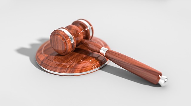 A wooden judge's gavel rests on a matching sound block against a light background, evoking the legal authority involved in premises liability claims and the importance of the statute of limitations in California.
